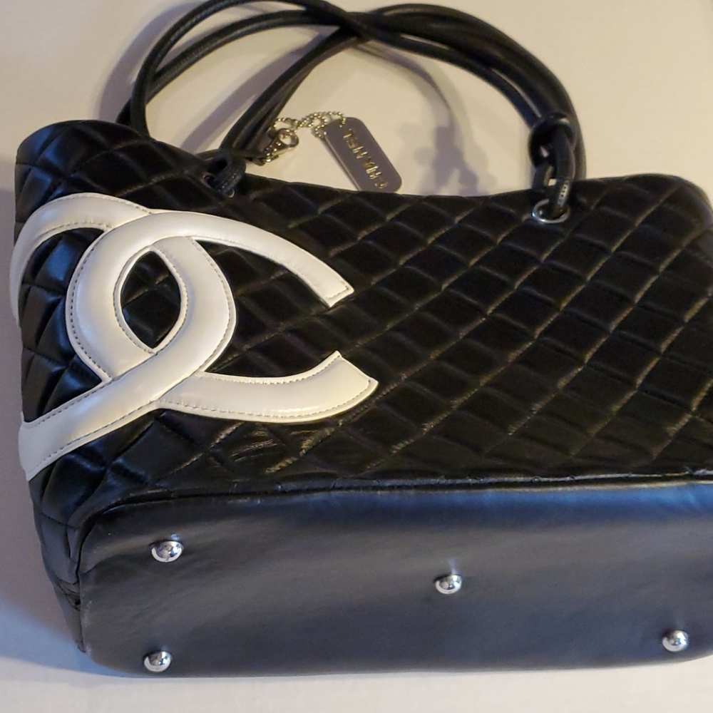 Black bag with pink insides. 15x10